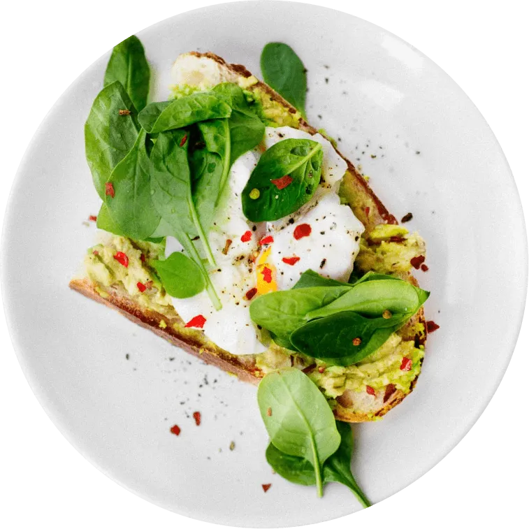 bread with fried egg and spinach on a white plate, meal from lovemydiet 